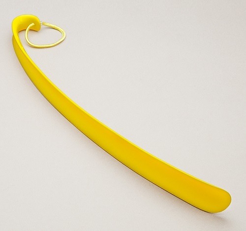 Plastic shoe horn in bright yellow